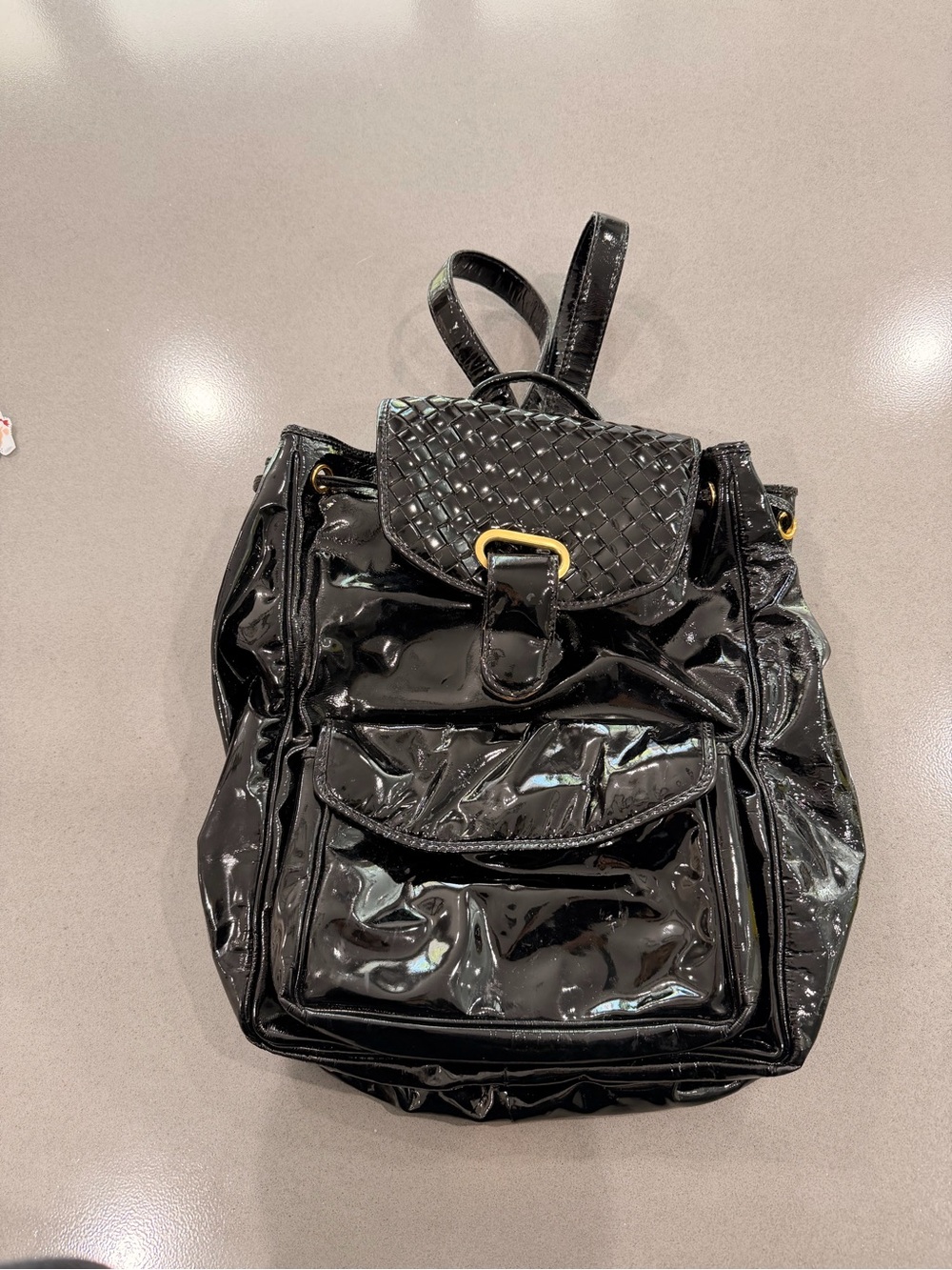 Bottega Veneta Black Patent Woven-Flap Backpack with Gold Buckle